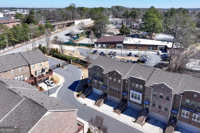 birds eye view of property with a residential view