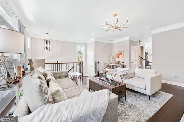 living area with baseboards, dark wood finished floors, ornamental molding, an inviting chandelier, and recessed lighting