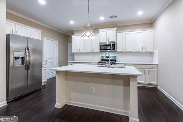 kitchen featuring stainless steel appliances, light countertops, a sink, and visible vents