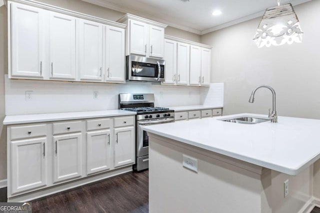 kitchen with crown molding, stainless steel appliances, light countertops, dark wood-type flooring, and a sink