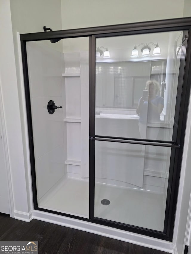 312 Overview Dr, Canton, GA 30114 - full bath featuring a stall shower and wood finished floors