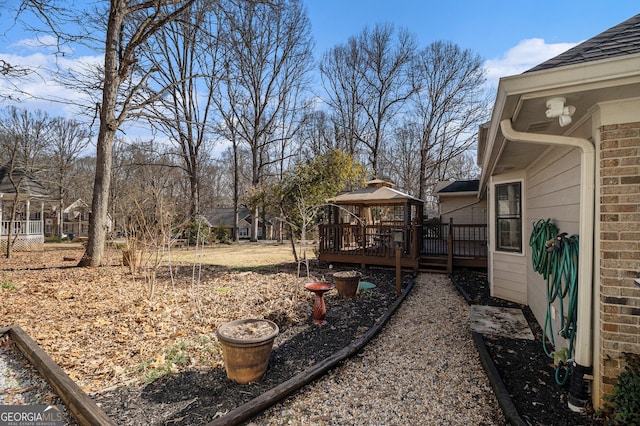 view of yard with a deck