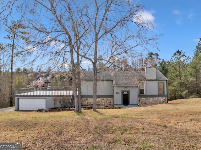 view of front of property with stone siding, a chimney, and a front lawn