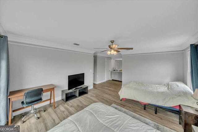 bedroom with baseboards, visible vents, a ceiling fan, ornamental molding, and wood finished floors