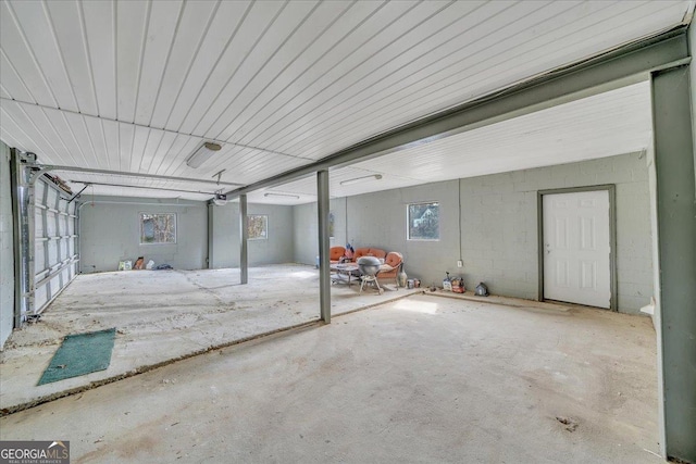 garage with concrete block wall