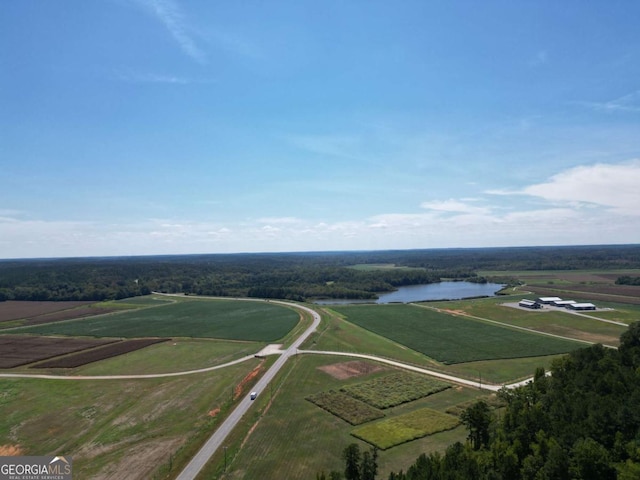 drone / aerial view with a rural view and a water view