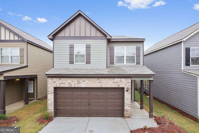 view of front facade featuring board and batten siding, brick siding, driveway, and an attached garage