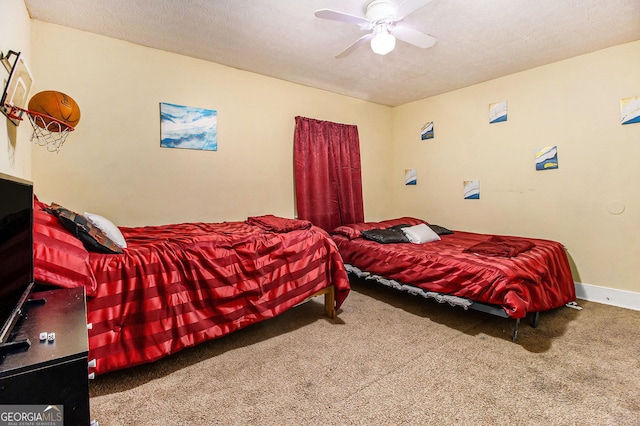 bedroom with baseboards, ceiling fan, carpet flooring, and a textured ceiling