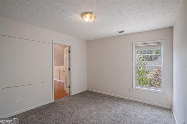 190 The Falls Blvd, Covington, GA 30016 - carpeted empty room with a textured ceiling and baseboards