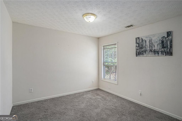 190 The Falls Blvd, Covington, GA 30016 - empty room featuring baseboards, a textured ceiling, and carpet floors