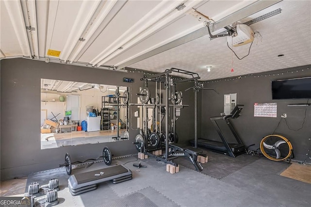 190 The Falls Blvd, Covington, GA 30016 - exercise room with a garage
