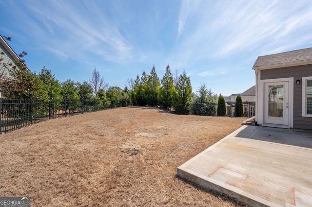 view of yard with a patio area and a fenced backyard