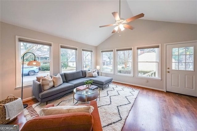 sunroom / solarium featuring a ceiling fan and lofted ceiling