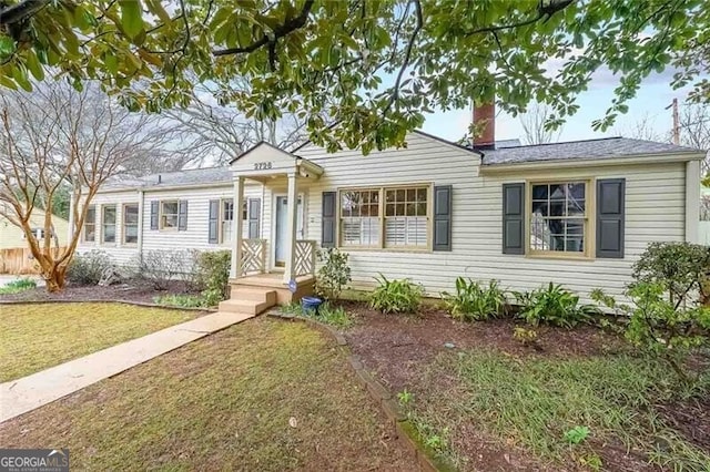 view of front of home with a front lawn