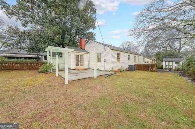 rear view of house featuring a patio area, french doors, a pergola, and fence