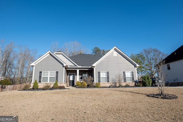 ranch-style home with a front lawn