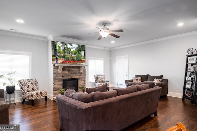 living room with ornamental molding, dark wood finished floors, and baseboards