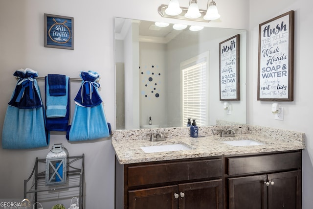 bathroom with double vanity and a sink