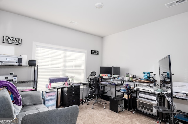 office area featuring carpet floors and visible vents