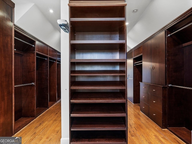 spacious closet featuring light wood finished floors