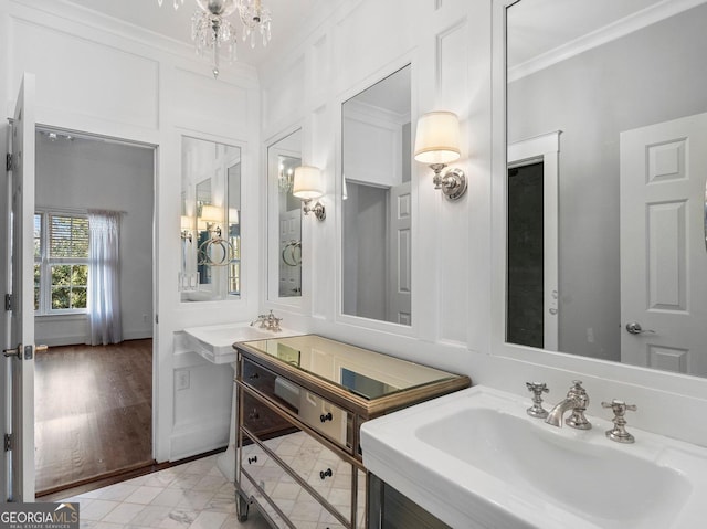 bathroom with a sink and crown molding