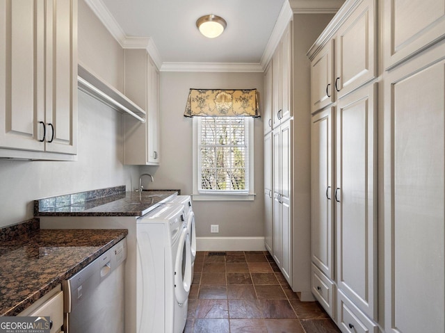 laundry room with laundry area, baseboards, independent washer and dryer, stone tile flooring, and crown molding