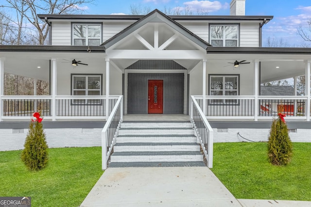 view of front of property featuring a porch, ceiling fan, and a chimney