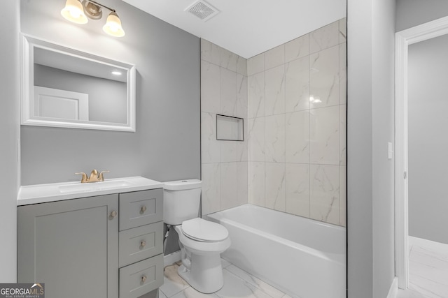 full bath featuring toilet, vanity, visible vents, marble finish floor, and tub / shower combination