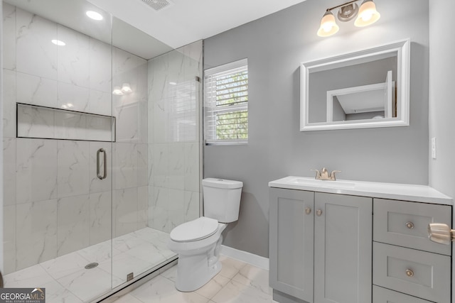 full bathroom featuring a marble finish shower, baseboards, toilet, marble finish floor, and vanity