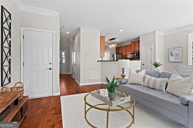 living room featuring baseboards, visible vents, dark wood finished floors, crown molding, and recessed lighting