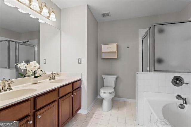 full bathroom featuring a stall shower, tile patterned flooring, a sink, and a bath