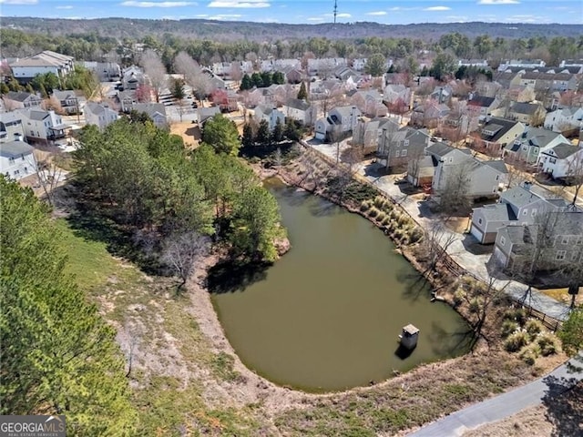 bird's eye view with a residential view and a water view