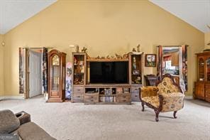 carpeted living room featuring vaulted ceiling