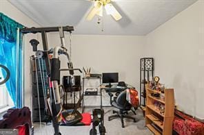 workout area featuring ceiling fan