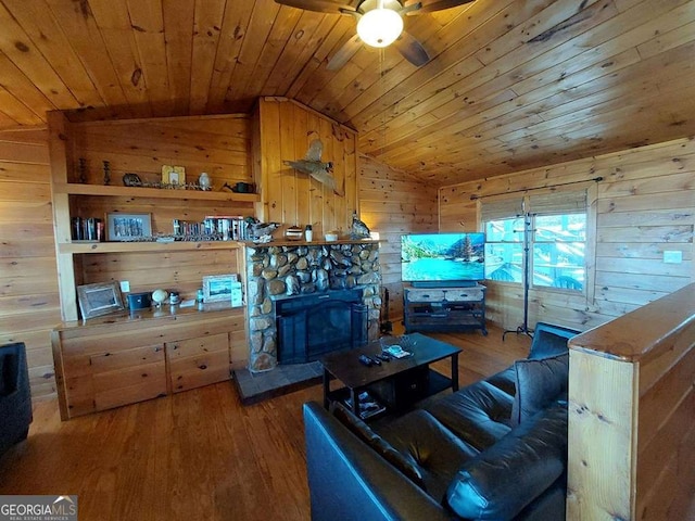 living area with lofted ceiling, wood walls, wood ceiling, and wood finished floors