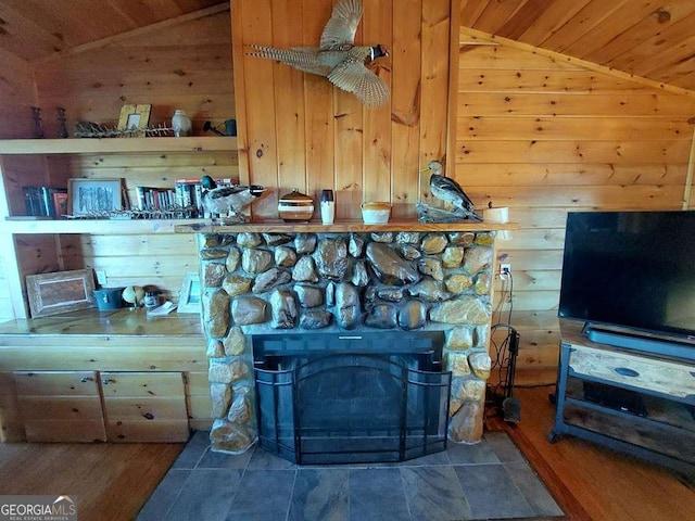 room details featuring wooden ceiling, a fireplace, and wooden walls