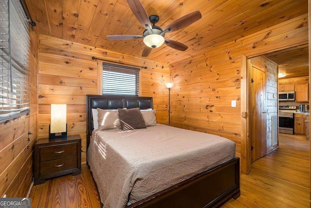 bedroom featuring wooden ceiling, wood walls, and wood finished floors