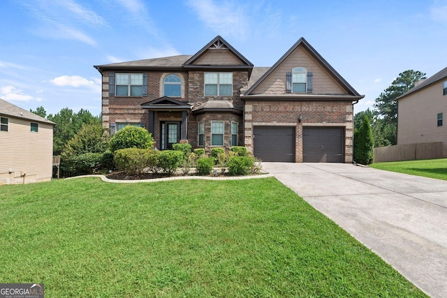 craftsman-style home featuring a front yard, brick siding, driveway, and fence