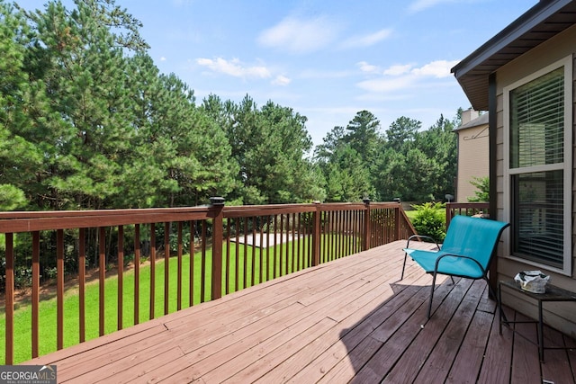 wooden terrace with a yard