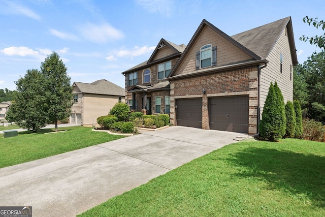 craftsman house with a garage, driveway, brick siding, and a front yard