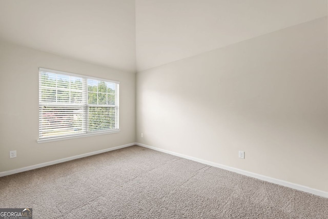 carpeted empty room with baseboards