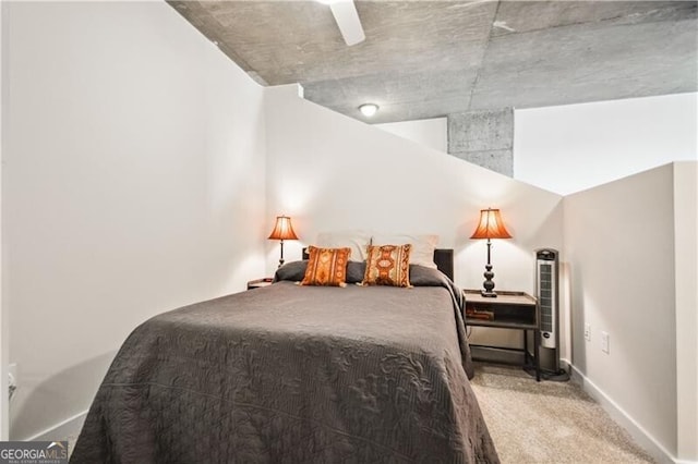 bedroom with carpet flooring and baseboards