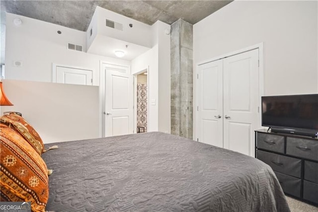 bedroom with visible vents and a closet