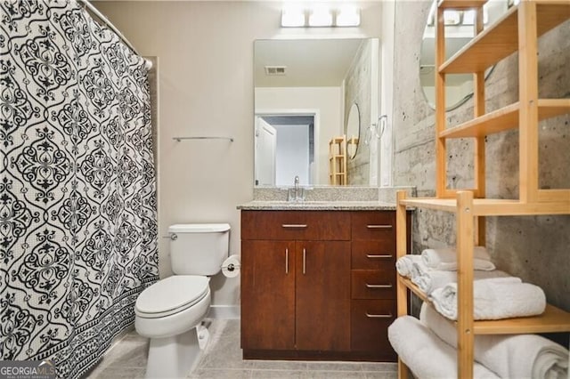 bathroom featuring curtained shower, visible vents, toilet, vanity, and tile patterned floors