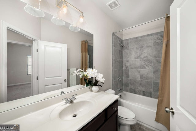 bathroom with toilet, visible vents, shower / tub combo with curtain, and vanity