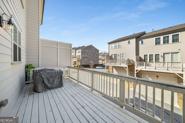 wooden deck with a residential view