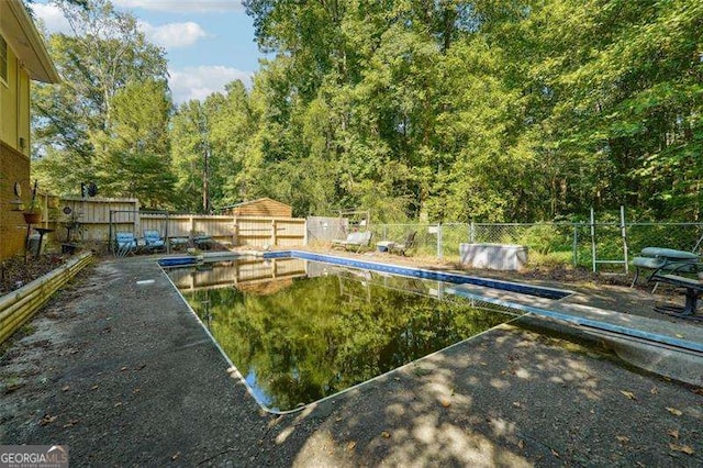 view of swimming pool featuring a fenced backyard