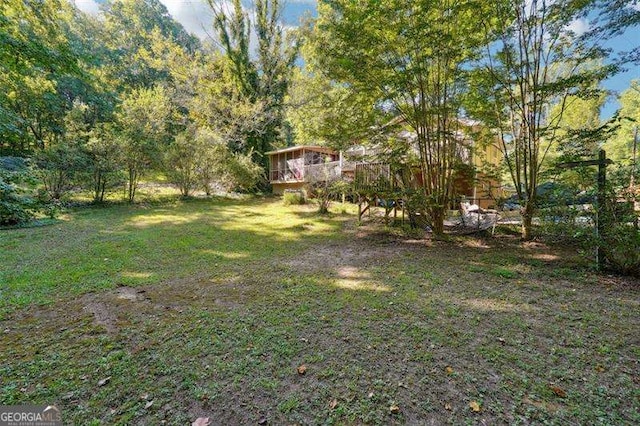 view of yard featuring a wooden deck