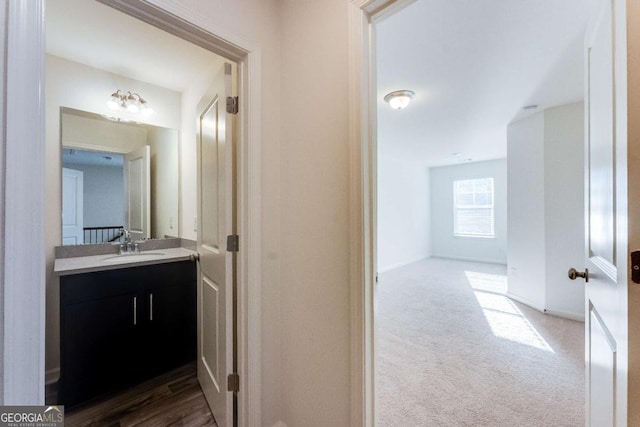 bathroom with vanity and baseboards