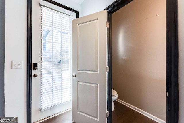 entryway featuring baseboards